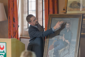 Sam Dalby unveiling his painting at Girton College for People's Portraits, our permanent collection